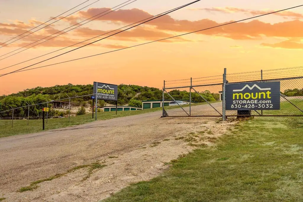 Gated entrance and sign at Mount Storage Kerrville on Medina Highway
