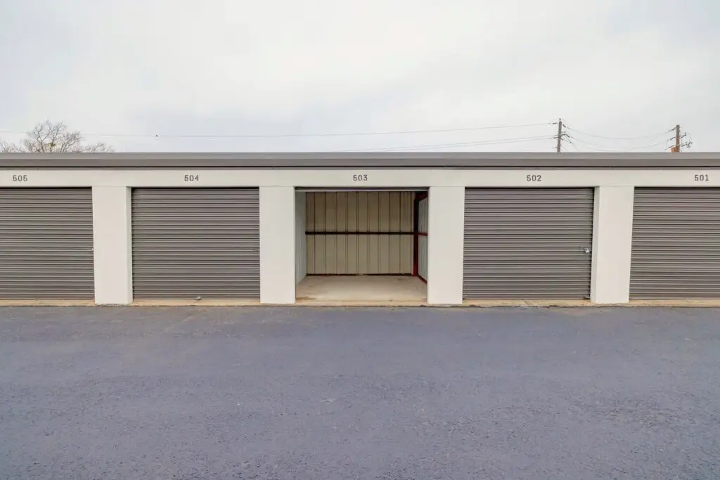 Drive-up storage units with an open roll-up door at Mount Storage Taylor
