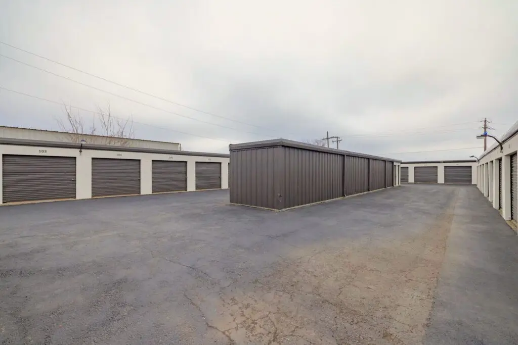 Paved drive between rows of drive-up storage units at Mount Storage Taylor